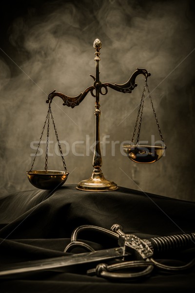 Scales and Sword of Justice on a judge's mantle Stock photo © Nejron