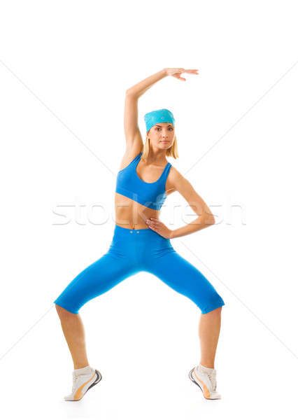 Beautiful young woman doing fitness exercise isolated on white b Stock photo © Nejron