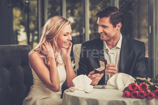 Man holding box with ring making propose to his girlfriend Stock photo © Nejron