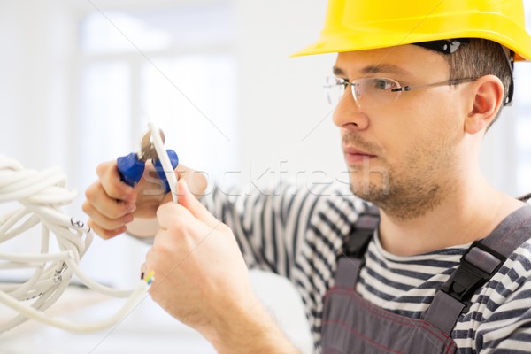 Electrician working with wires in new apartment  Stock photo © Nejron