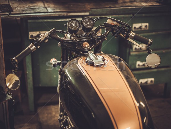 Vintage style cafe-racer motorcycle in customs garage  Stock photo © Nejron