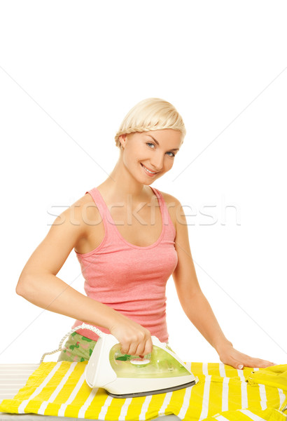 Beutiful woman  ironing clothes. Isolated on white background Stock photo © Nejron