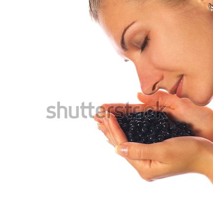 Beautiful girl with a handful of blueberries Stock photo © Nejron