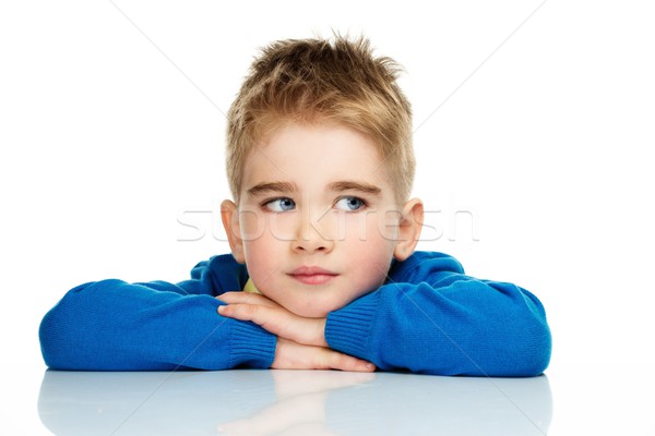 Dreaming little boy in blue cardigan and yellow shirt  Stock photo © Nejron