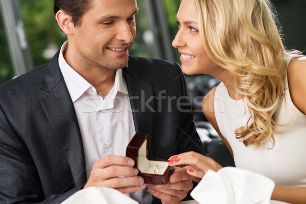 Man holding box with ring making propose to his girlfriend Stock photo © Nejron