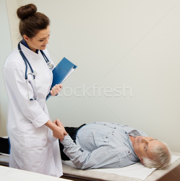 Senior man lying at daybed at doctor's office Stock photo © Nejron