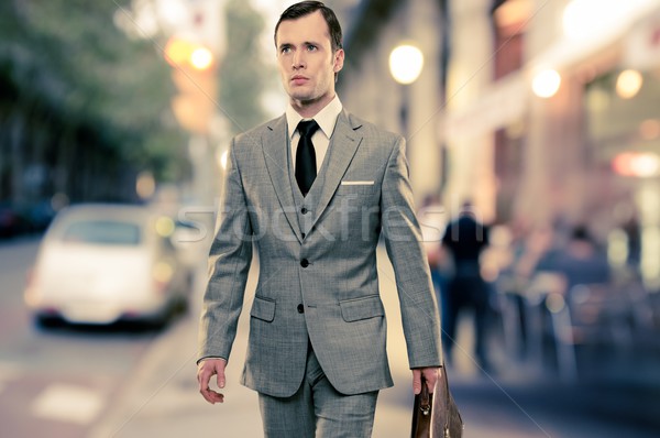 Homme classique gris costume serviette marche [[stock_photo]] © Nejron