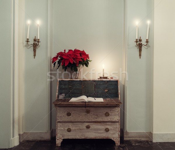 Straw vase with red flower on a chest of drawers in a hall way  Stock photo © Nejron