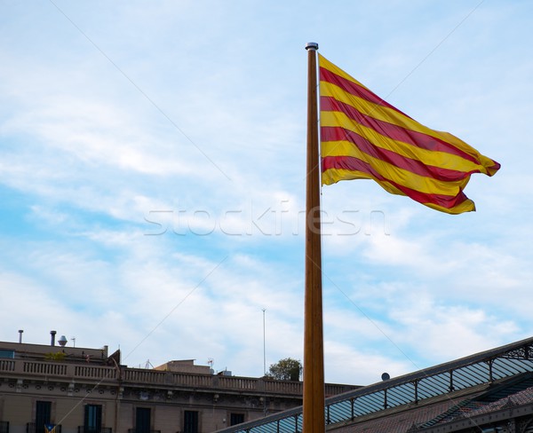 Catalan flag on a rooftop against blue sky in Barcelona, Spain Stock photo © Nejron