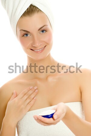 Young lovely woman applying moisturizer to her skin after shower Stock photo © Nejron