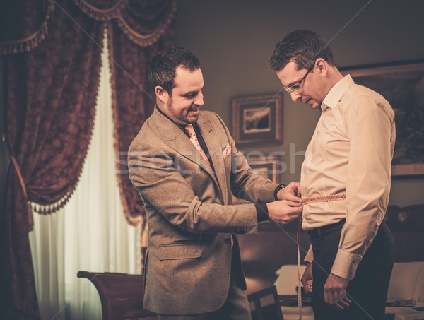 Tailor measuring client for custom made suit tailoring  Stock photo © Nejron