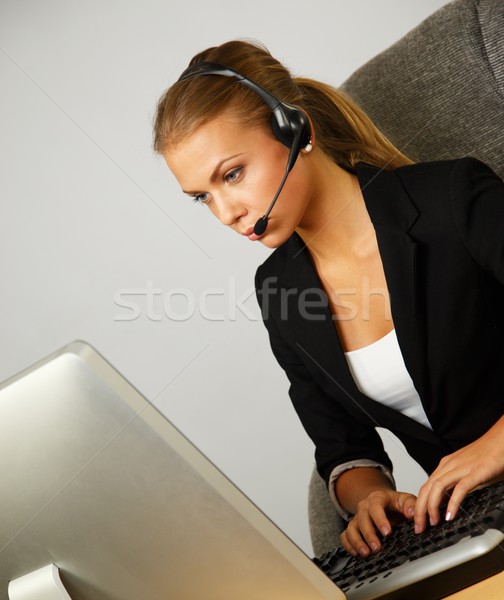 Beautiful help desk office support woman with headset Stock photo © Nejron