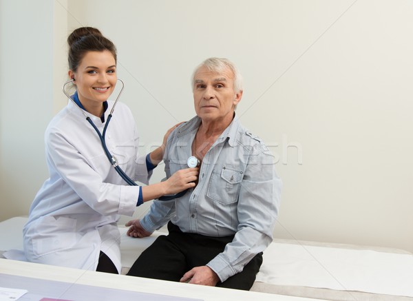 Senior man and doctor woman with stethoscope Stock photo © Nejron