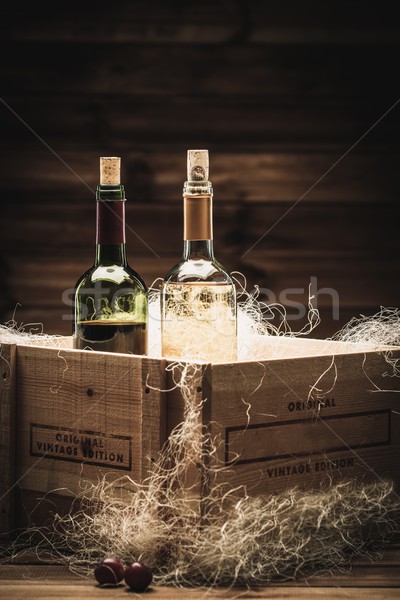 Bottle of red and white wine in wooden box Stock photo © Nejron