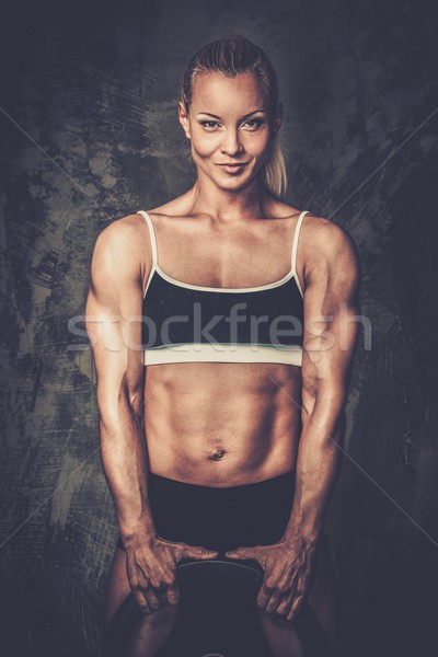 Beautiful muscular bodybuilder woman with weights  Stock photo © Nejron