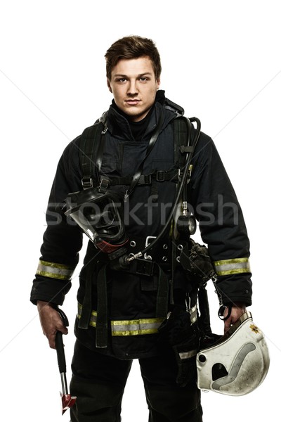 Young firefighter with helmet and axe isolated on white  Stock photo © Nejron