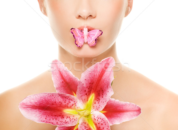 Butterfly sitting on a lips of a beautiful woman. Isolated on wh Stock photo © Nejron