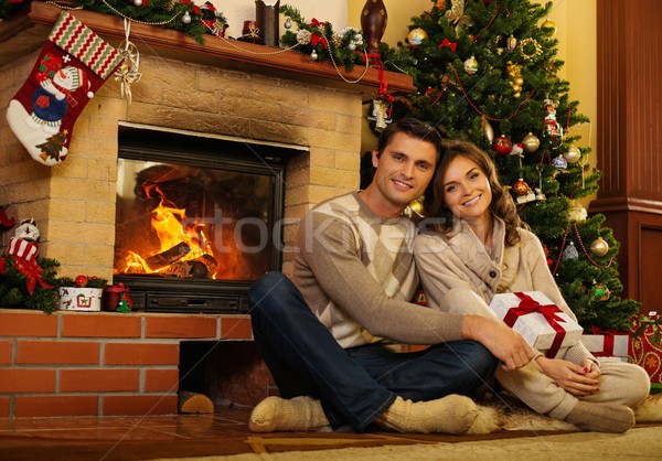 ストックフォト: カップル · 暖炉 · クリスマス · 装飾された · 女性