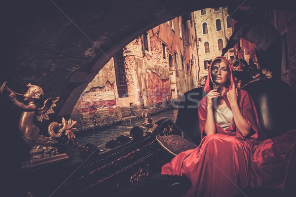 Gyönyörű nő piros köpeny lovaglás gondola város Stock fotó © Nejron