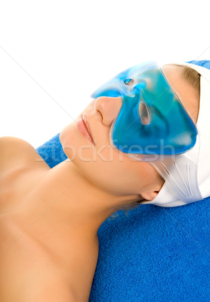 Beutiful woman with blue gel mask on her eyes Stock photo © Nejron