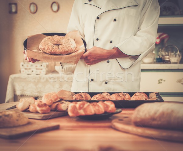 Cook hands holding homemade baked goods Stock photo © Nejron