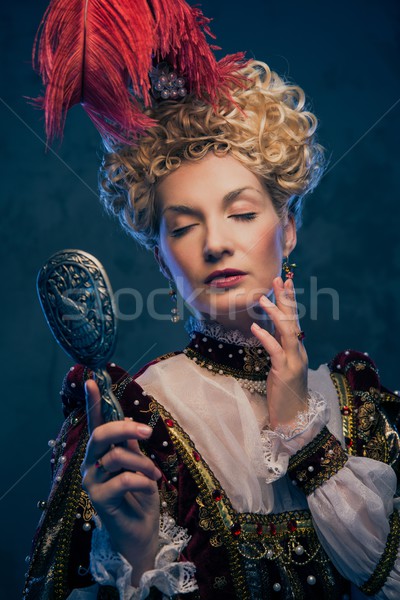 Haughty queen in royal dress with mirror Stock photo © Nejron