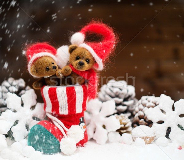 Stock photo: Small toy bears in christmas stoking 