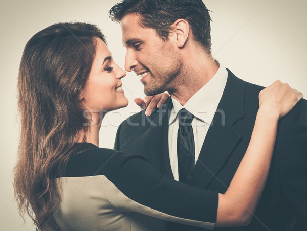 Happy smiling couple in suit and dress  Stock photo © Nejron