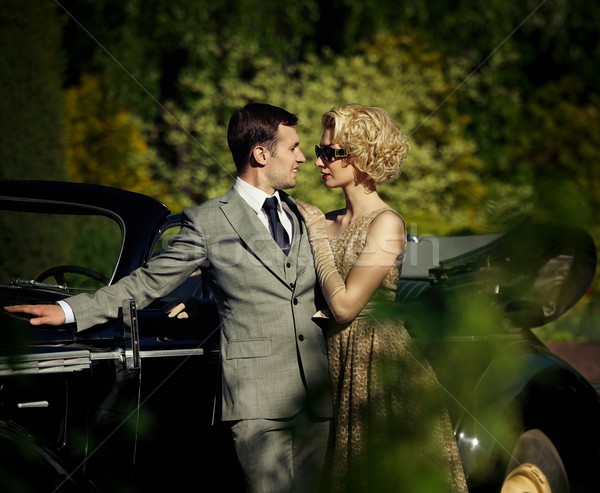 Couple near a retro car outdoors Stock photo © Nejron