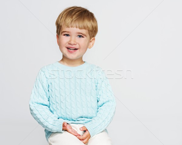 Smiling baby boy in blue pullover Stock photo © Nejron