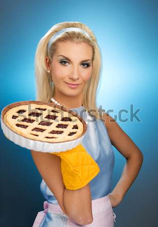 Stock photo: Beautiful woman holding hot italian pie. Retro stylized portrait