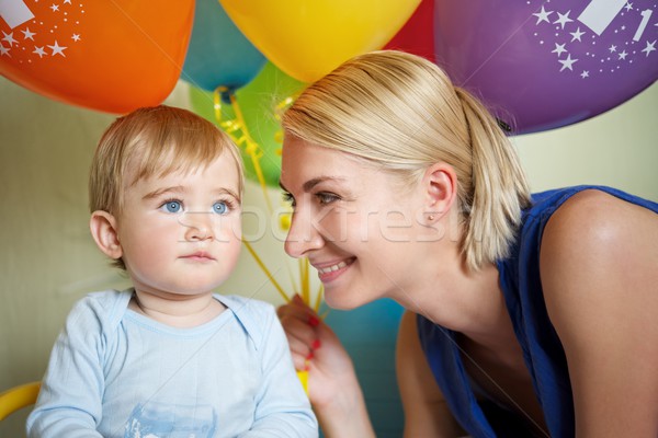 Happy mother with her baby celebrating birthday Stock photo © Nejron