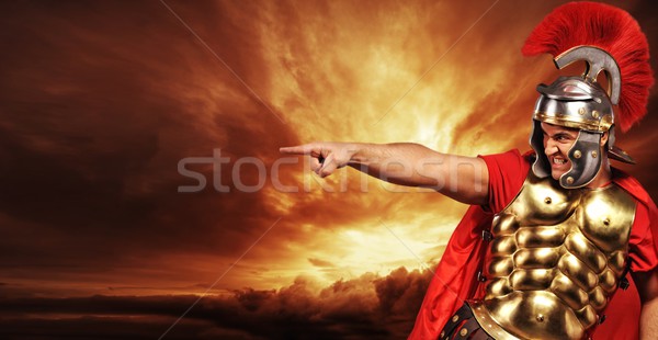 Legionary soldier over stormy sky Stock photo © Nejron