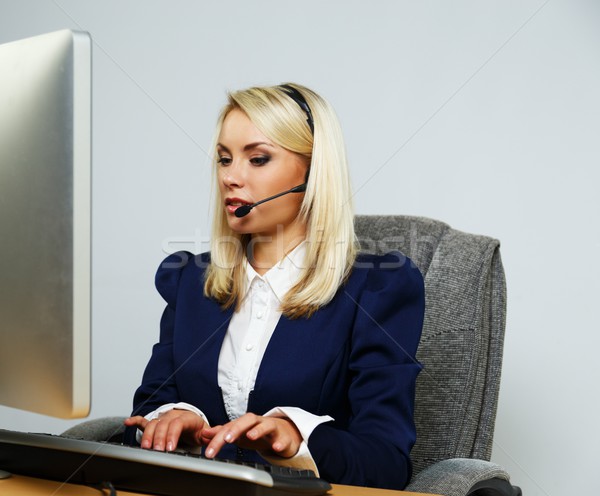 Beautiful blond help desk office support woman with headset Stock photo © Nejron