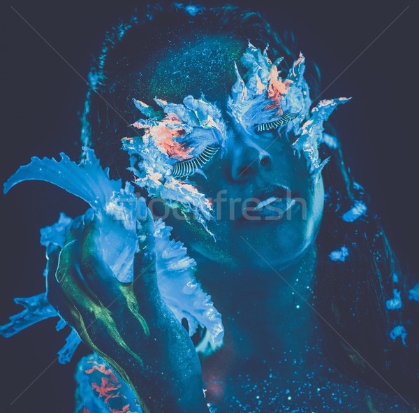 Portrait of beautiful woman with body art glowing in ultraviolet light Stock photo © Nejron