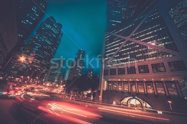 Fast moving cars at night in modern city Stock photo © Nejron