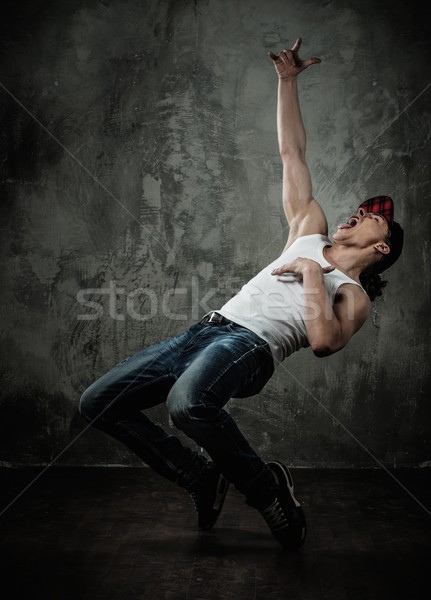 Man dancer showing break-dancing moves Stock photo © Nejron