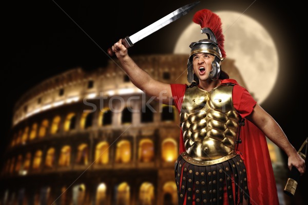 Roman legionary soldier in front of coliseum at night time Stock photo © Nejron