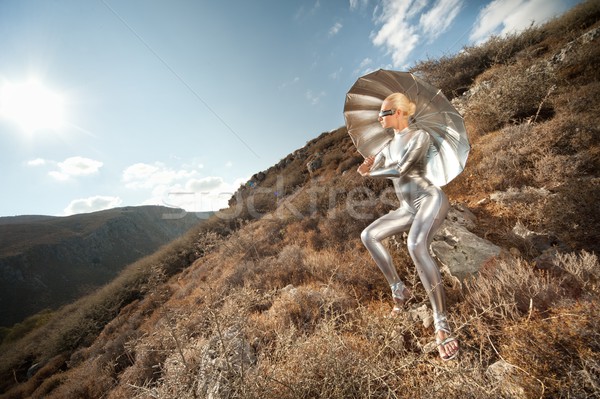 Femme parapluie montagnes ciel mode coucher du soleil [[stock_photo]] © Nejron