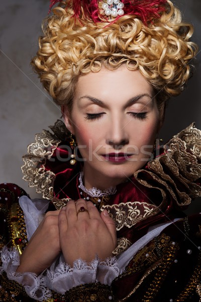 Picture of beautiful haughty queen in royal dress Stock photo © Nejron