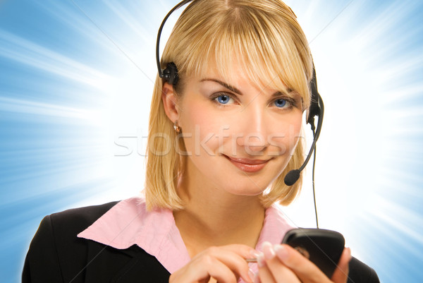 Beautiful hotline operator with cellphone in her hands on abstra Stock photo © Nejron