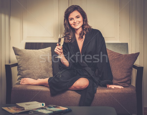 Femme peignoir détente verre champagne chambre d'hôtel [[stock_photo]] © Nejron