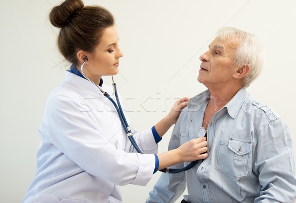 Senior man and doctor woman with stethoscope Stock photo © Nejron