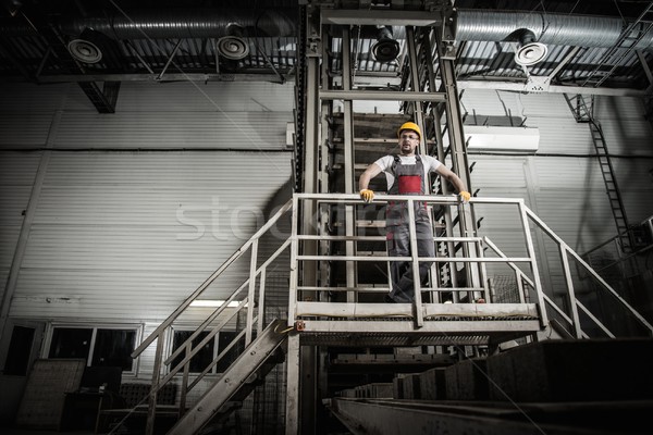 Man in a safety hat on a factory  Stock photo © Nejron