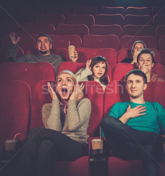 Group of young people watching movie in cinema Stock photo © Nejron