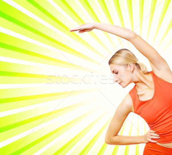 Beautiful young fitness trainer over abstract background Stock photo © Nejron