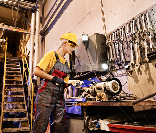 Factory female worker sharpening tools Stock photo © Nejron