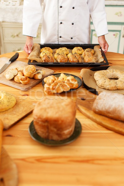 Woman hands holding baking tray with homemade baked goods Stock photo © Nejron