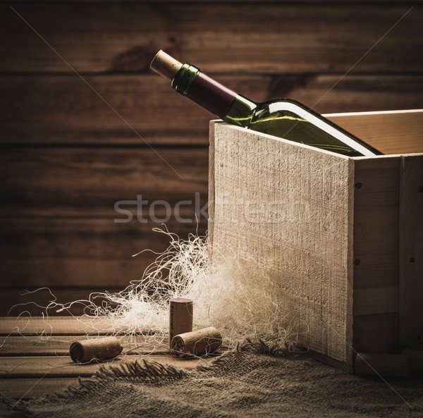 Bottle of wine in box in wooden interior  Stock photo © Nejron