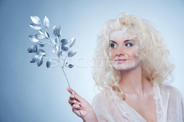 Stock photo:  Snow queen with a magic twig
